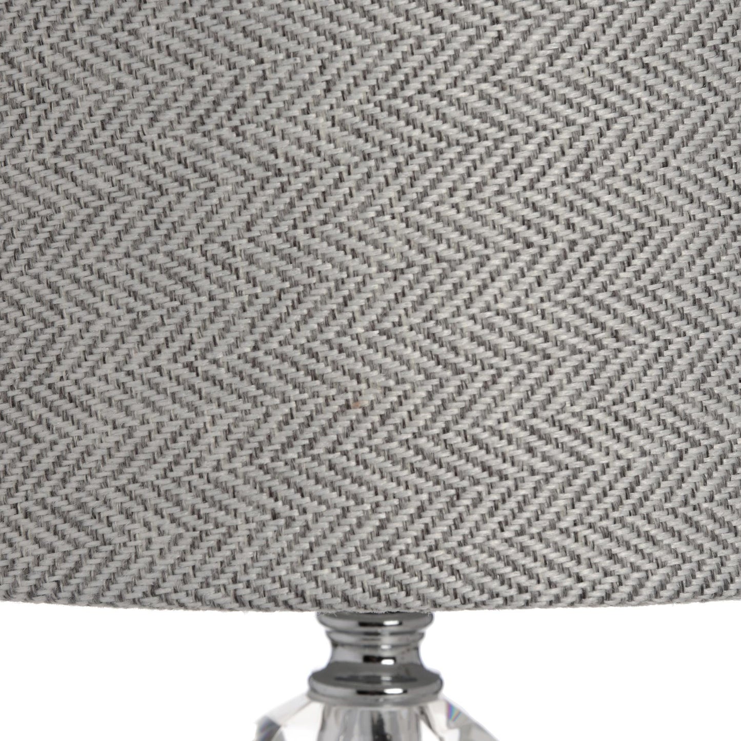 Radiance Chrome Table Lamp has a striking sleek lamp base combined with a timeless grey herringbone shade.