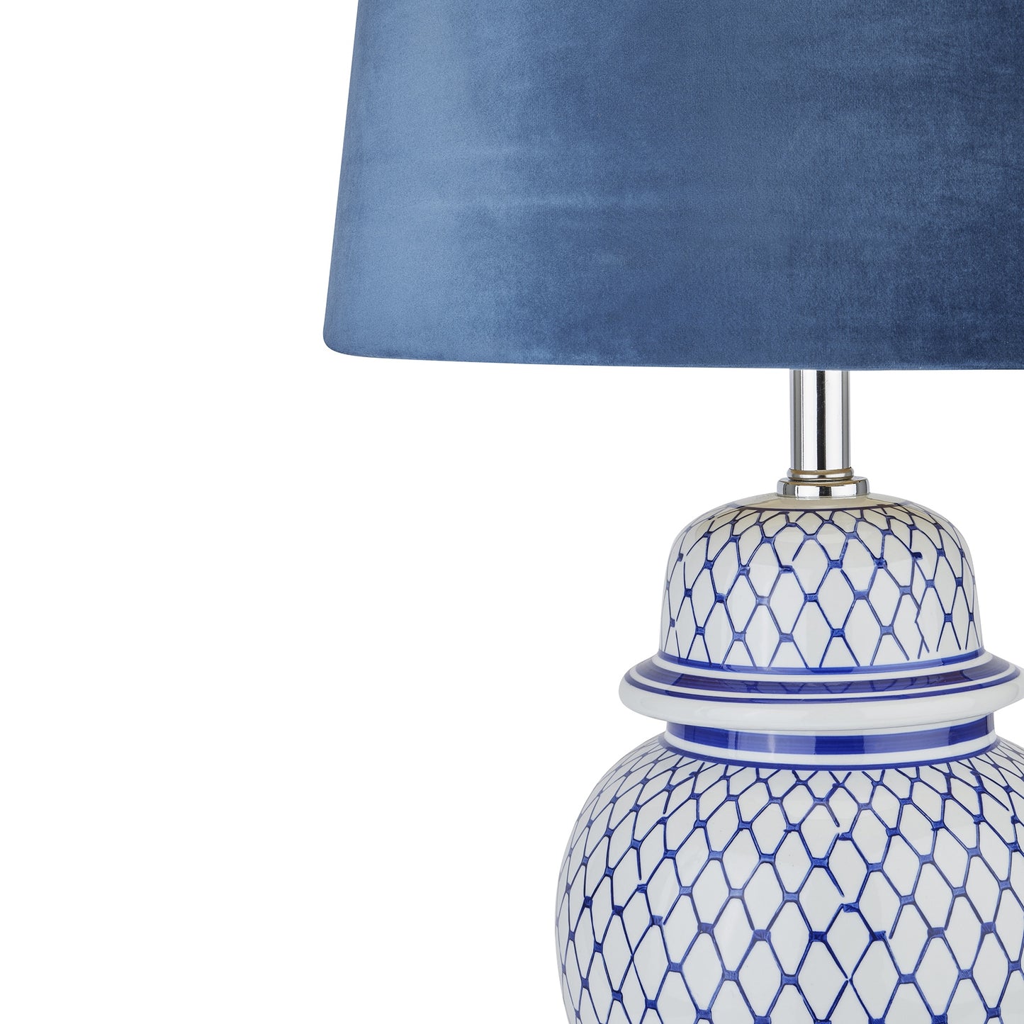 Serenity Blue And White Ceramic Table Lamp With Blue Velvet Shade and hand-painted and glazed ginger jar-shaped ceramic base.