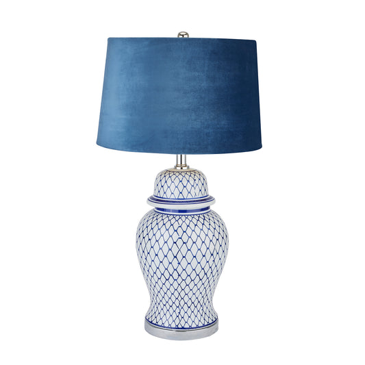 Serenity Blue And White Ceramic Table Lamp With Blue Velvet Shade and hand-painted and glazed ginger jar-shaped ceramic base.